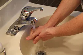 Closeup of hands being washed Closeup of hands being washed